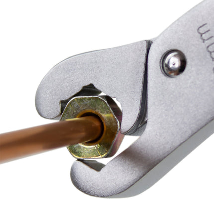 Lockjaw wrench shown ratcheting round a nut on the end of a pipe